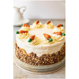 Carrot cake with butter cream icing  With pecans toppings